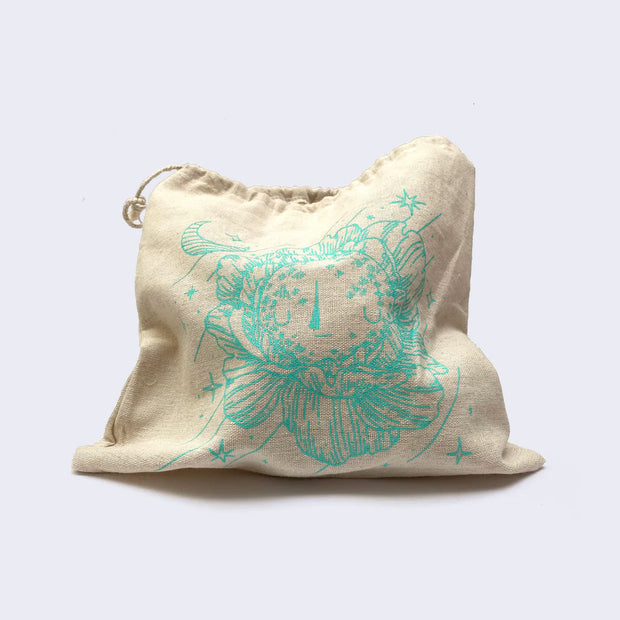 Photo of a hemp tote bag with a print of a line drawing of a moonflower.