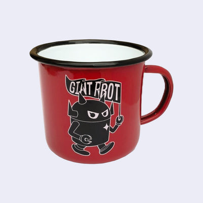 Bright red enamel mug with a graphic of a black robot with a white outline, toting a rippled flag that reads "Giant Robot." Rim of the mug is lined black with a white interior.