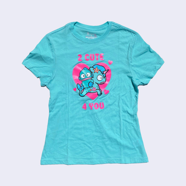 Front side of bright aqua t-shirt. Bright pink text says 2 cute 4 you. On chest area is Hangyodon and Unicorno with a large heart backdrop.