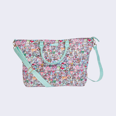 Large purse style tote bag, with mint blue pleather handle and a long mint blue adjustable sling strap. Bag has a small "tokidoki" nameplate on the upper center and  is covered completely in a busy pastel color pattern featuring tokidoki characters with cafe food and drink imagery.