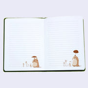 Open spread of journal pages, white with lined ruling and a small illustration of Totoro holding an umbrella around some smaller Totoros and two children on the bottom right of each page.