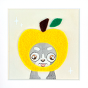A square felt art piece featuring a cute cartoon dog peeking out from behind a large yellow apple with a green leaf and brown stem, set against a cream background with small white sparkle motifs.
