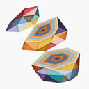 Geometric designed layered cut paper sculpture, creating a three dimensionality. A multi sided shape is cut into 3 layers, with each layer showing the cross section of several layers of cut paper. Colors are earthy toned blues, oranges, yellows, purples and reds.