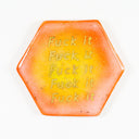 Hexagon shaped ceramic tile with bright yellow to orange gradient coloring with gold font that reads "fuck it" over and over again.