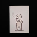 A minimalist line-art work on a white rectangular card, showing a simple stick-figure character smoking with a small puff of smoke. The card is photographed at an angle against a solid black background.