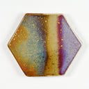 Hexagon shaped ceramic tile with a glossy glaze and orange, yellow, blue, brown and purple loose striping design, with gold splatters as well.