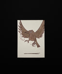 A square art print featuring a brown bird with wings spread, holding a tea cup and cigarette, centered on a black background.
