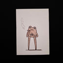 A minimalist art print featuring a hand-drawn cartoon frog smoking, set against a solid black background.