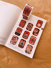 Stamp shaped washi tape featuring Asian thematic illustrations in orange, black and white.