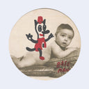 Doodle atop of a baby photo, of a cat like creature with a long nose and red hat.