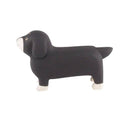 Black dachshund-shaped wooden figure on a white background