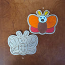 2 wooden sculpture of mothra.