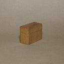 Small wooden block on a beige background