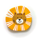 Clay flat sculpture of a brown lion cat with a cute cartoon smiling face and a round mane.