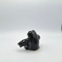 Side of black ceramic sculpture