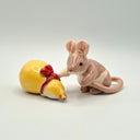 Ceramic mouse and gourd figurine on a plain background