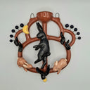 Decorative wall piece with ceramic animals on a circular brown flat vessel.