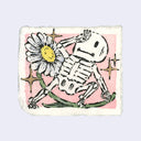 Ink and watercolor illustration of a small cartoon skeleton, standing atop the curved stem of a white daisy. Background is pink with gold sparkles.