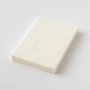 Cream colored notebook on a light gray background