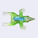 A small translucent green kaiju toy figurine with a red spiked back, a red gem on its head, and clear transparent claws and tail, shown against a light gray background.