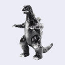 A metallic silver Godzilla figurine standing upright, featuring a glossy, reflective finish and detailed sculpting, set against a solid light gray background.
