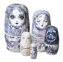 Set of 5 nesting dolls with ballpoint ink illustrations on each of them.