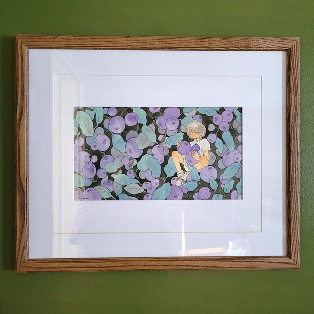 Watercolor illustration of a person sitting amongst many large blueberries, still attached to their branches with leaves as well. Piece is matted in a think wooden frame.