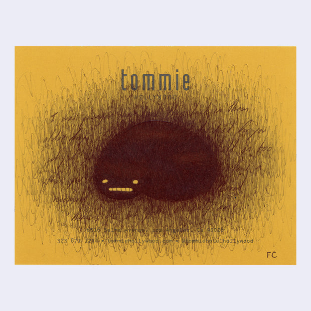 Scribbled ink drawing on yellow paper of a black bob, covering writing.