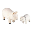2 small white wooden figurines of pigs - one is larger than the other.