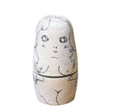 Set of 5 nesting dolls with ballpoint ink illustrations on each of them.