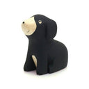 Black bear figurine with beige face on a white background
