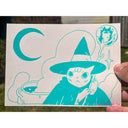 Blue ink illustration of an anthropomorphic cat, dressed as a wizard with a staff, standing in front of a boiling kettle.