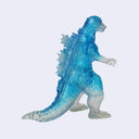 A translucent blue and white Godzilla figure, shown from a side profile against a light gray background.