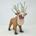 Ceramic sculpture of a deer character, with a painted red face, fluffy white beard and many, many ivory colored antlers coming out of its head. It has bird-like feet with talons.