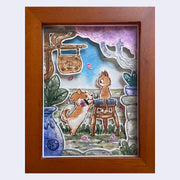 Framed shadow box style watercolor collage of a cute dog holding a flower in its mouth and jumping up on a stool where a surprised looking cat sits. They are on a patio like area with potted plants and signage.