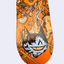 Skateboard deck with a detailed illustration of a cat and mechanical elements on an orange background