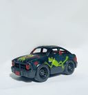 Small black toy car with a painting of Kermit the Frog on the front, roof and asides with red star patternings.