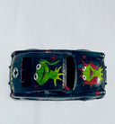 Small black toy car with a painting of Kermit the Frog on the front, roof and asides with red star patternings.