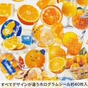 Glittery display of stickers themed around oranges, the fruit itself and orange adjacent foods.