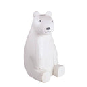 White polar bear wooden figurine on a white background