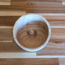 Wooden bowl on a wooden surface