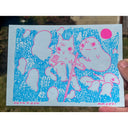 Blue and pink ink illustration of a cat with a bandaged hand, sitting in grass with a long, thin sword and a ghost.
