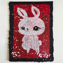 Illustration of a white cartoon bunny with white paint splatters on a red and black background.
