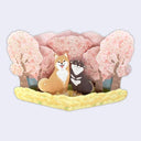 3D paper greeting card of many cherry blossom trees and 2 shiba inu dogs sitting in front of them, one smiles and the other has its tongue out.
