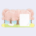 Back of a card with cherry blossoms trees and an illustrated dog rolling around, next to a small white area to write in.