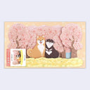 3D paper greeting card of many cherry blossom trees and 2 shiba inu dogs sitting in front of them, one smiles and the other has its tongue out.