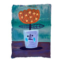 Painting of an orange flower in a silver cup. The cup has a crying character face on it.