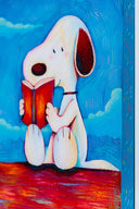 Colorful illustration of Snoopy, sitting atop of his red dog house reading a book, a pile of books sits nearby. The sky is blue with blue clouds. Close up shot shows color detailing.