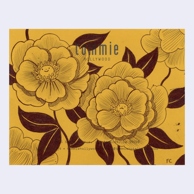 Black ink drawing of 2 flowers on yellow paper. Buds of the flowers have a little smiley face.