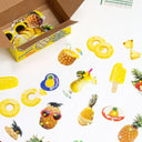 Glittery display of stickers themed around pineapples, the fruit itself and pineapple adjacent foods and drinks.